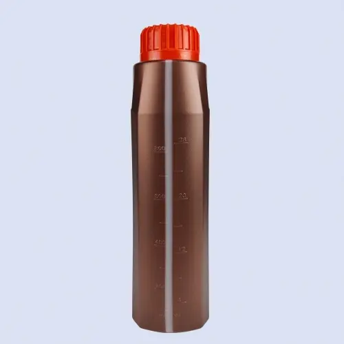 Side view of brown plastic oil bottle with volume measurement markings