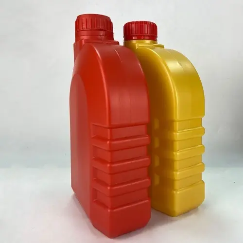 Angled view of red and yellow engine oil measuring bottles with grip ribs.