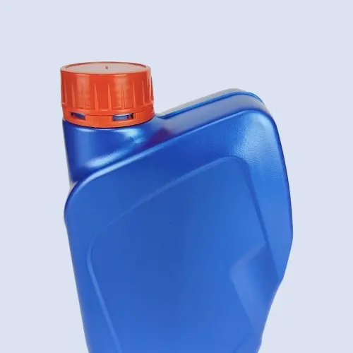 Close-up angled view of blue lubricant bottle with orange threaded cap