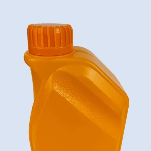 Close-up view of orange HDPE engine oil bottle with textured grip area and screw cap