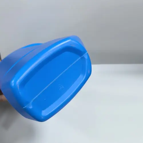 Bottom view of 1 liter plastic jerry bottle for automotive lubricant packaging.