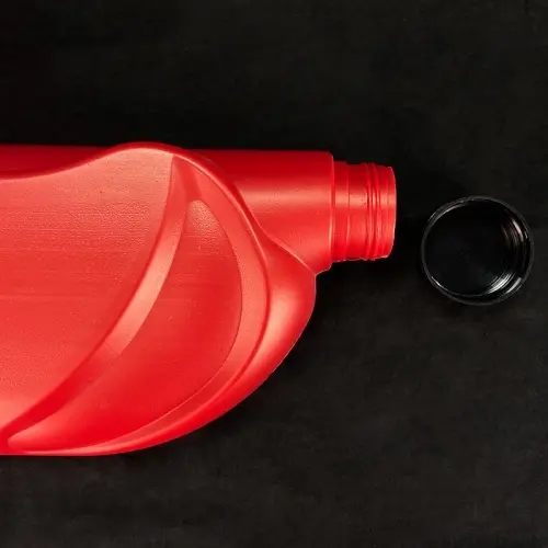 Red motor oil bottle showing threaded neck opening with cap removed