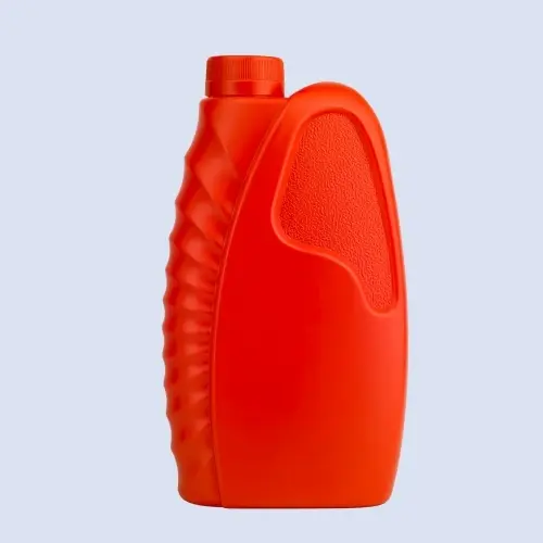 Red motorcycle engine oil bottle with textured grip panel front view