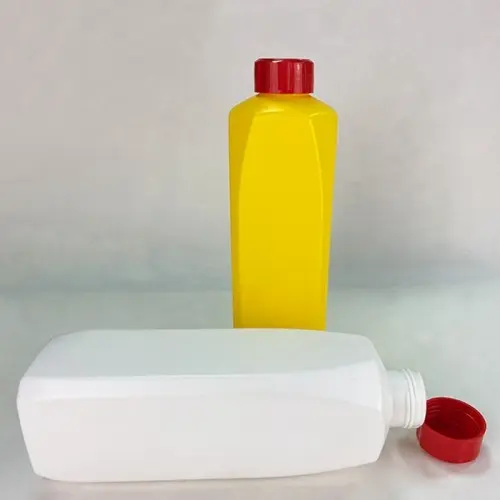 Yellow and white square lubricant bottles showing cap and bottle opening