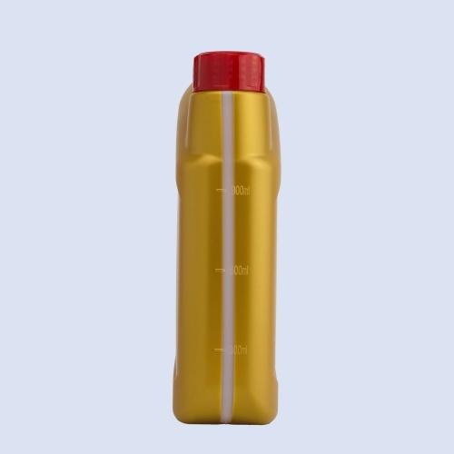 Side view of yellow HDPE oil bottle with volume measurement markings