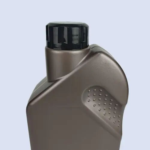 Close up of brown motor oil container with black screw cap and textured grip panel