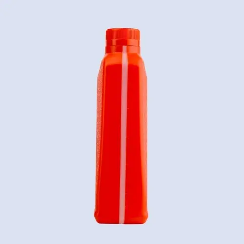 Side view of red motor oil packaging bottle showing slim profile and measurement strip